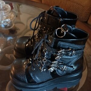 3" platform combat black faux leather boots with silver hardware. Size 8.